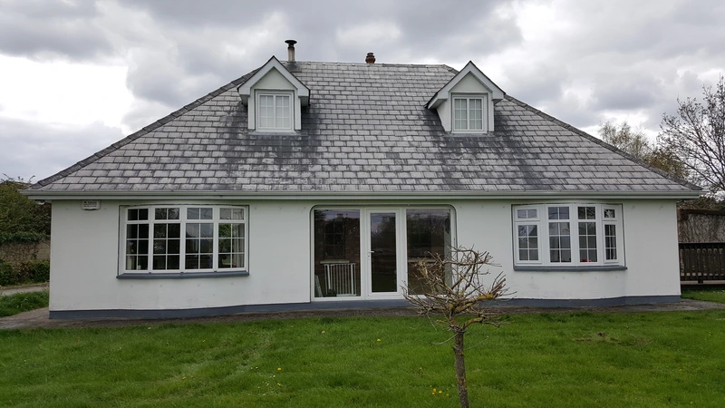 Roof tiles being cleaned and primed before painting