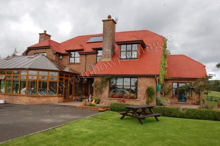 Red Roof house after being newly spray painted.