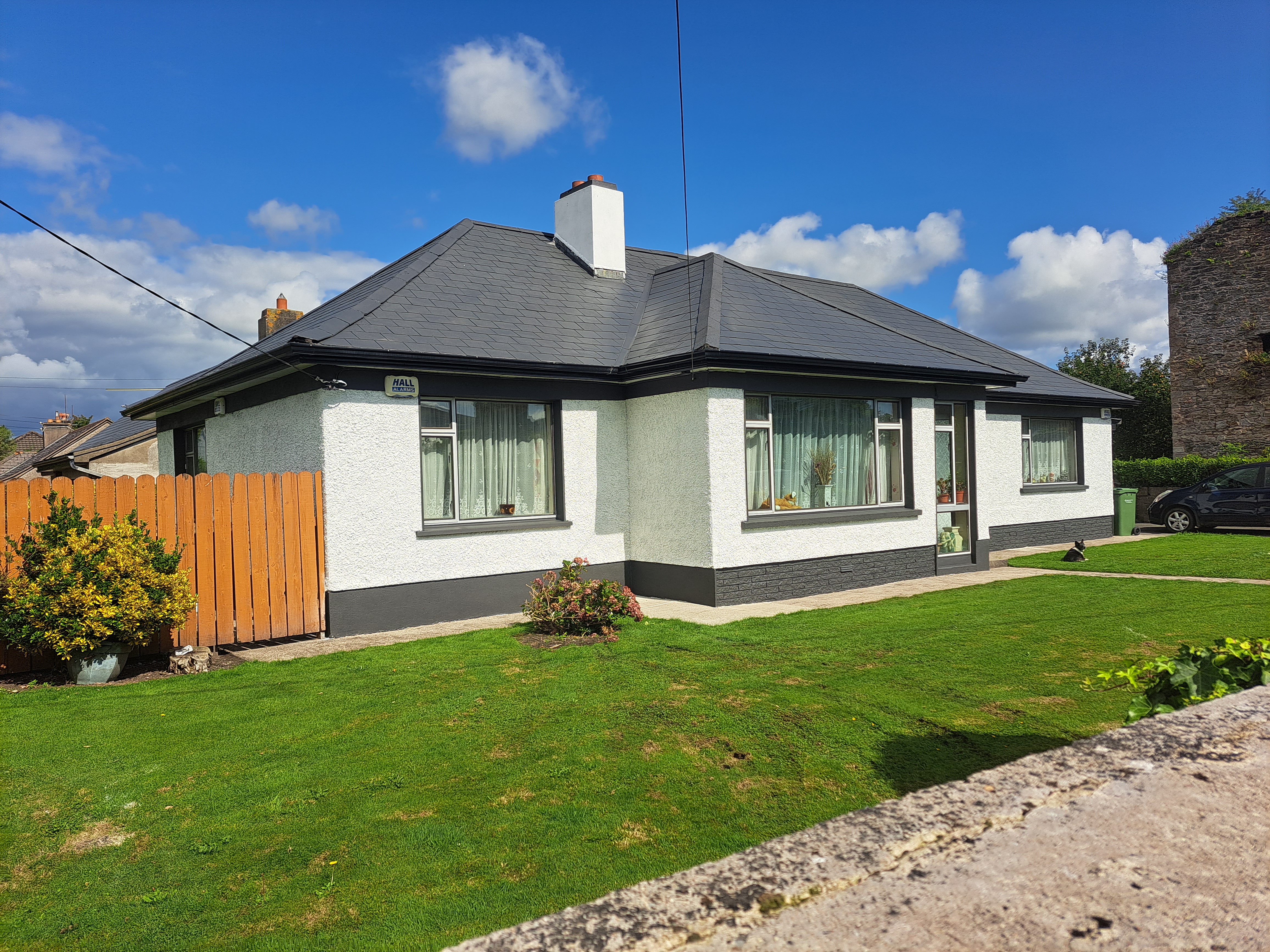 A roof that has been spray painted by Rainbow Roofing